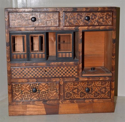 Lot 366 - A Japanese inlaid table cabinet