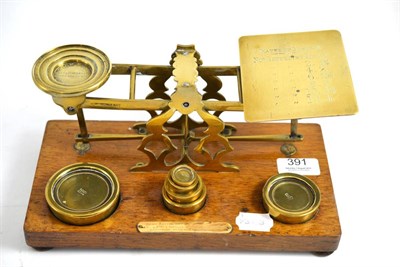 Lot 391 - Set of brass postal scales and weights