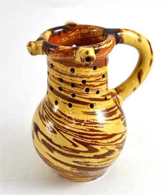 Lot 399 - A puzzle jug, 19cm high