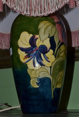 Lot 420 - A Moorcroft Hibiscus pattern table lamp and shade