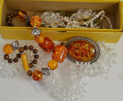 Lot 458 - A freshwater pearl necklace, a crystal necklace and clips and an amber necklace