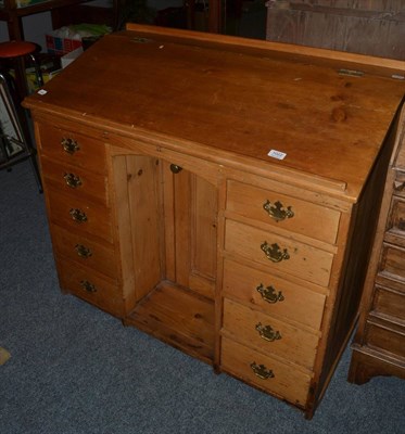 Lot 1022 - A Victorian pine slope top kneehole desk