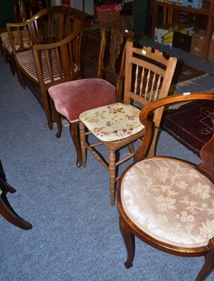 Lot 1049 - An Edwardian mahogany inlaid settee, two bedroom chairs and four dining chairs