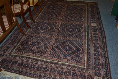 Lot 1076 - Balouch rug, Persian/Afghan Frontier, the compartmentalised field of hooked medallions enclosed...