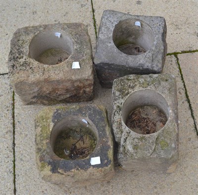 Lot 1120 - Four small stone troughs/garden planters