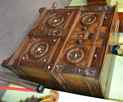 Lot 1196 - A 17th century style oak and inlaid side cabinet