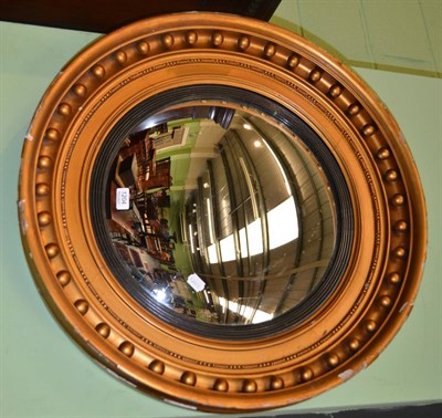 Lot 1204 - A 19th century giltwood circular convex mirror