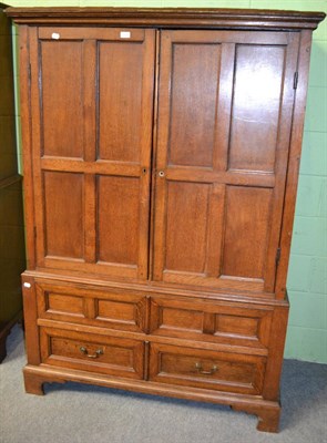 Lot 1208 - A 19th century panelled oak press cupboard