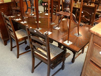 Lot 1227 - Oak draw leaf table and four ladder back chairs