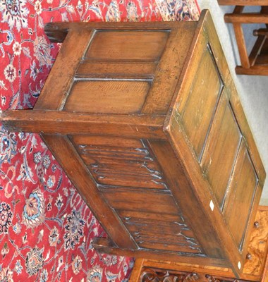 Lot 1244 - Early 20th century oak coffer with triple indented panel top above a twin linen fold panel front on