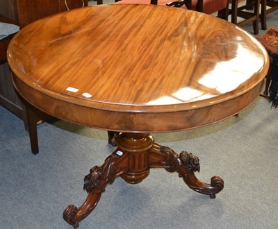 Lot 1247 - A Victorian walnut circular top table on turned and carved pillar and tripartite base (adapted)