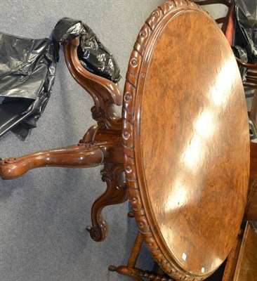 Lot 1252 - A Victorian burr walnut oval breakfast table, circa 1870, the quarter-veneered top above a...