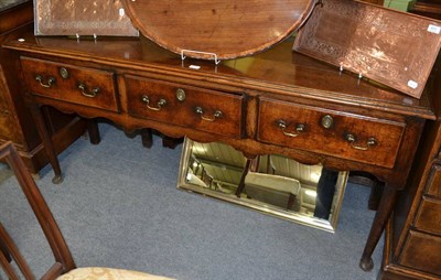 Lot 1258 - An 18th century oak low dresser with slender legs and pad feet