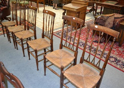 Lot 1261 - A set of six Arts & Crafts dining chairs with rush seats