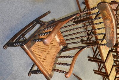 Lot 1274 - A 19th century bobbin spindled rocking chair with cane seat