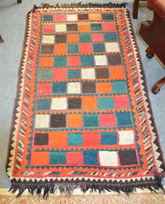 Lot 1278 - A Gabbeh rug, South West Persian, the polychrome compartmentalised field enclosed by barber...