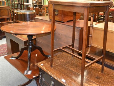 Lot 1302 - Two mahogany occasional tables on tripod bases and a fold-over card table (3)