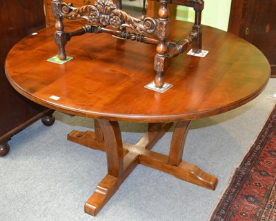 Lot 1305 - An Alan Grainger Acorn Industries circular dining table, in the Cotswold tradition, on four...