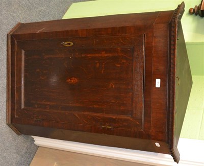 Lot 1312 - George III oak straight fronted hanging corner cupboard