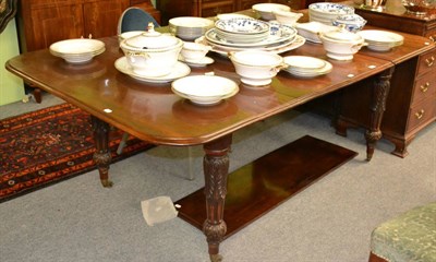 Lot 1331 - Mid-Victorian mahogany extending dining table on acanthus sheathed fluted baluster legs