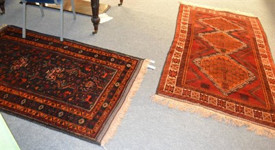 Lot 1346 - Balouch rug, South West Afghanistan, the blood red field with three diamond medallions enclosed...