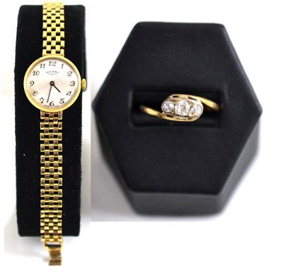 Lot 7 - A 9ct gold Rotary lady's wristwatch together with a 9ct gold and diamond three stone ring