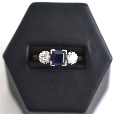 Lot 21 - A sapphire and diamond three stone ring, stamped '18CT' and 'PLAT'
