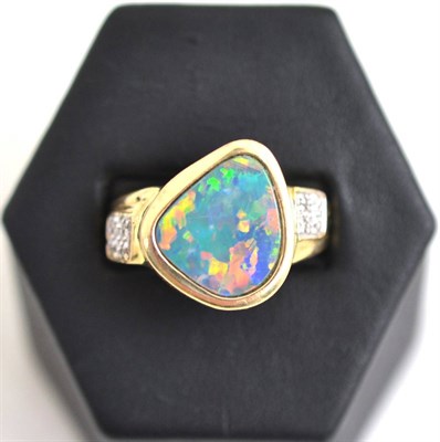 Lot 45 - A 14k gold diamond and opal triplet ring