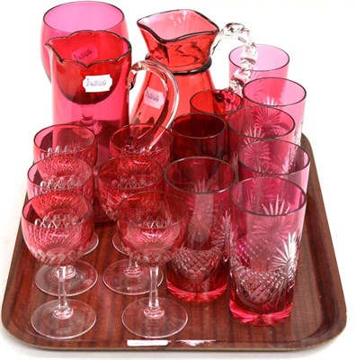 Lot 58 - Cranberry glass: six etched beakers/tumblers, six etched wine glasses, a square section water...