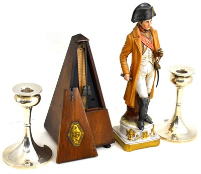 Lot 84 - Two matched silver loaded candlesticks, Capodimonte figure of Napoleon and a metronome