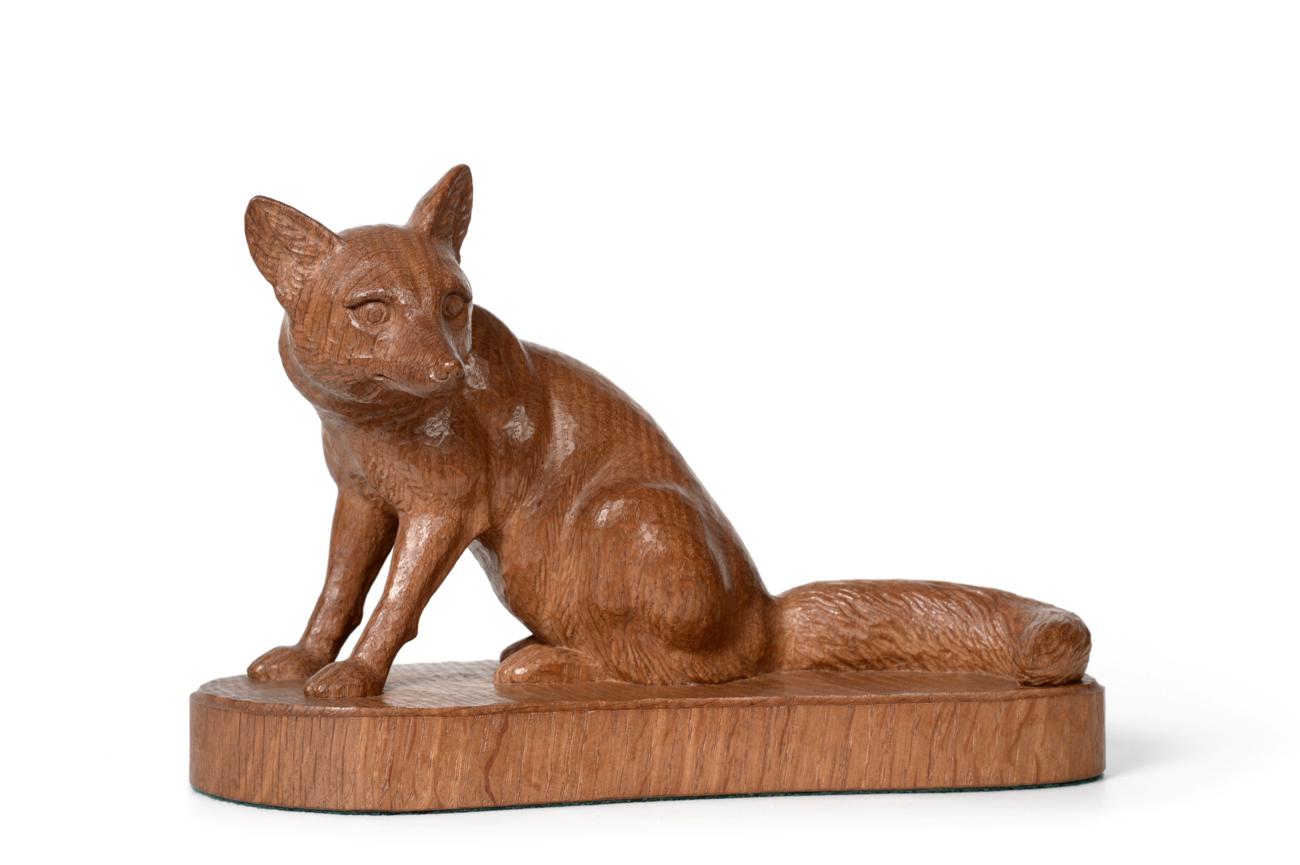 Lot 752 - Woodpeckerman: A Stan Dodds (1928-2012) Carved English Oak Fox, in a seated pose, with recessed...