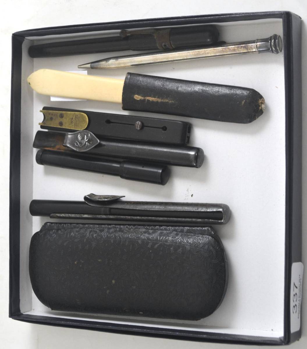 Lot 337 - A quill cutter, two swan pen holders, an eraser, three pens and one pencil etc