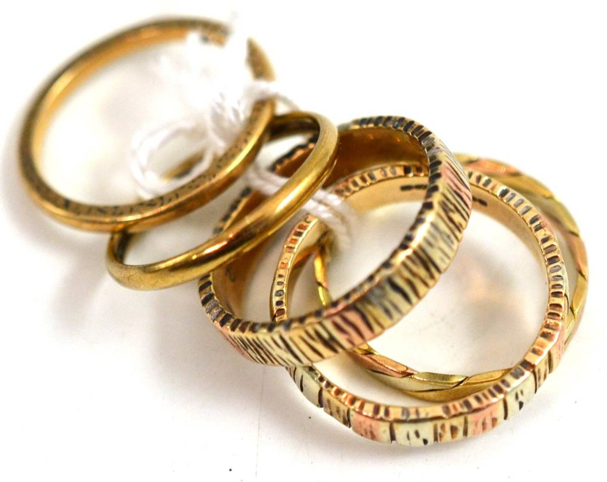 Lot 369 - Four 9ct gold band rings and another band ring (5)