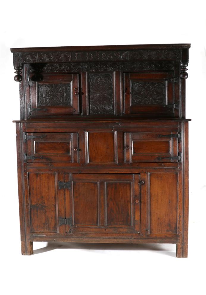 Lot 844 - A 17th Century Joined Oak Westmorland Court Cupboard, carved with initials ID and dated 1696,...