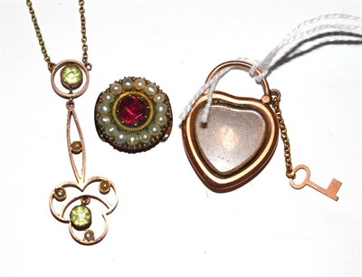 Lot 16 - A peridot and seed pearl drop necklace, a foil backed garnet and pearl cluster and a heart...