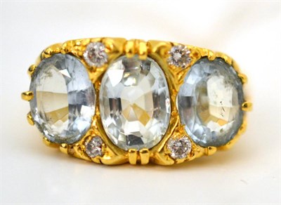 Lot 29 - An 18ct gold aquamarine and diamond ring
