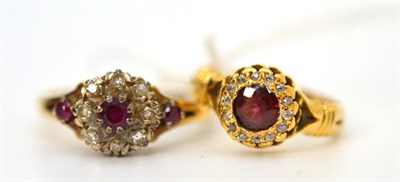 Lot 46 - An 18ct gold ruby and diamond cluster ring and a 9ct gold ruby and diamond cluster ring (2)
