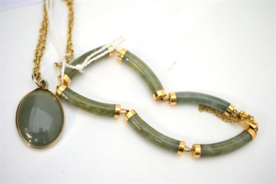 Lot 48 - A jade bracelet and a jade pendant on 9ct gold chain