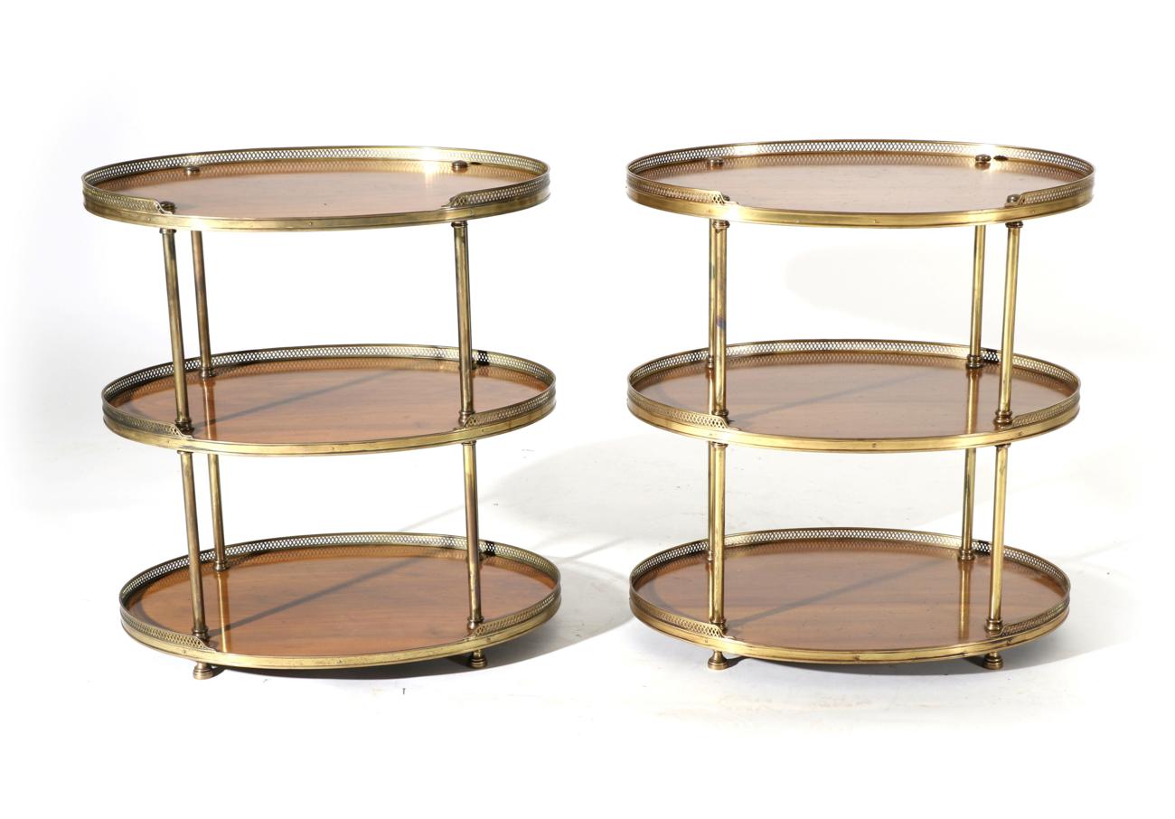 Lot 864 - A Pair of Early 20th Century Walnut and Brass Mounted Three Tier Tables, of oval form, with...
