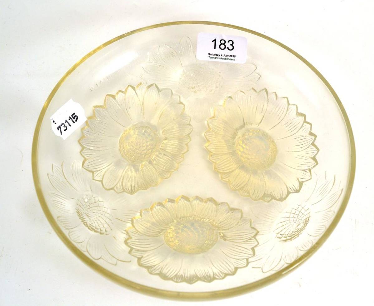 Lot 183 - A Rene Lalique Vernon pattern opalescent and clear glass bowl, moulded with sunflower heads,...