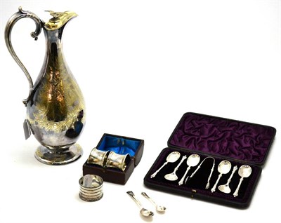 Lot 17 - A group of silver and plated objects to include: a silver plated pear-shaped claret jug with bright