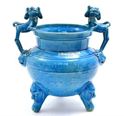 Lot 23 - A Chinese fan ding form vessel with twin fo dog handles on a turquoise ground