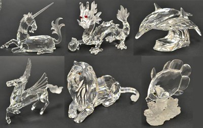 Lot 43 - A collection of Swarovski models including a unicorn, two dragons and flaming pearls, Pegasus...