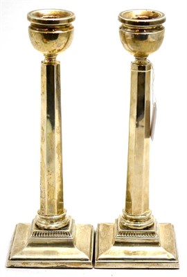 Lot 53 - Pair of loaded silver candlesticks