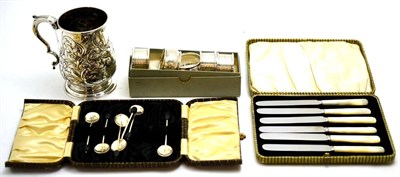 Lot 57 - Silver tankard, later decorated, cased spoons, fruit knives and five silver napkin rings