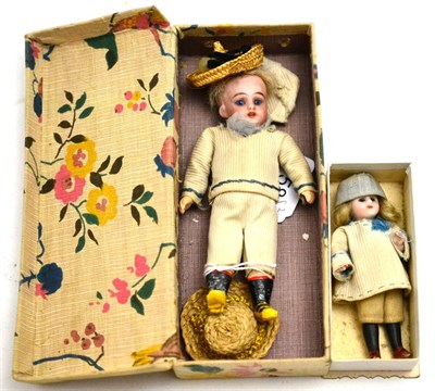 Lot 58 - Miniature bisque dolls house doll, with fixed eyes, blond wig, bisque lower arms and legs,...