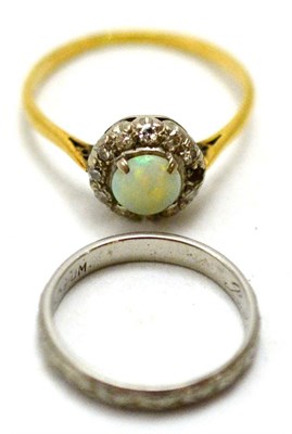 Lot 63 - An opal and diamond cluster ring, one diamond deficient, and a patterned band ring, stamped...