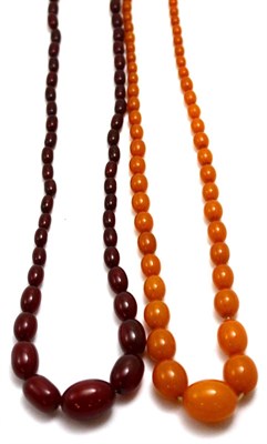 Lot 66 - An amber-type bead necklace and a red bakelite necklace (2)