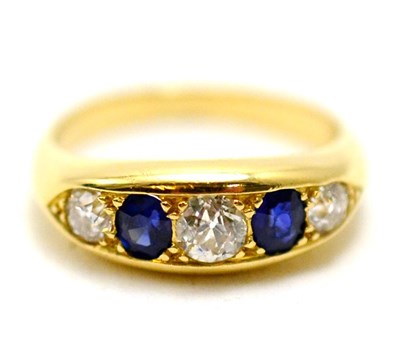 Lot 86 - A diamond and sapphire five stone ring '18CT'