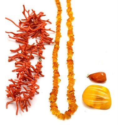 Lot 89 - An amber bead necklace, two amber pendants and a twig coral necklace